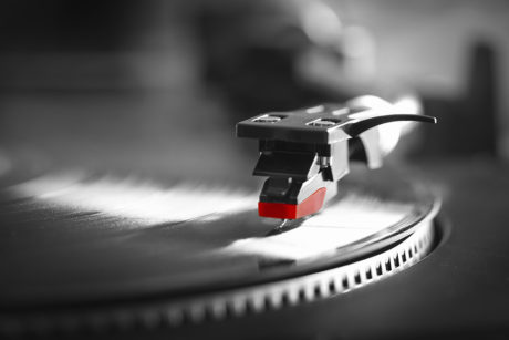 Record turntable playing vinyl record